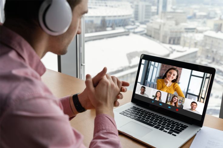 Video call grid with several business leaders