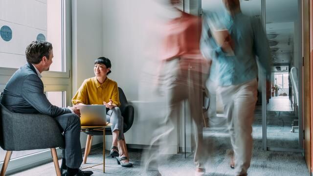 Small leadership team working together around a table